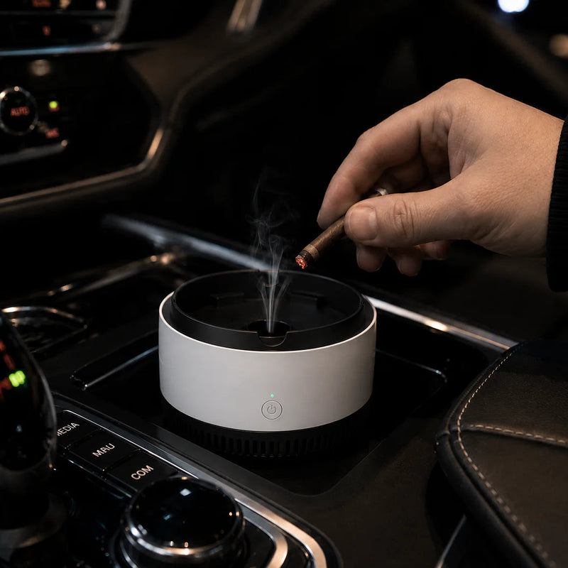 EmberFlow smokeless ashtray pulling smoke downward inside a car